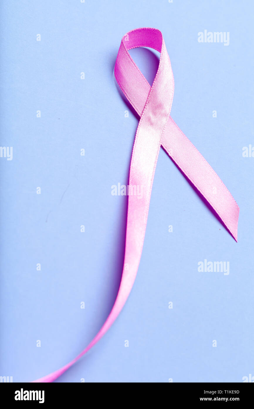 ribbon HIV, AIDS on blue background Stock Photo - Alamy