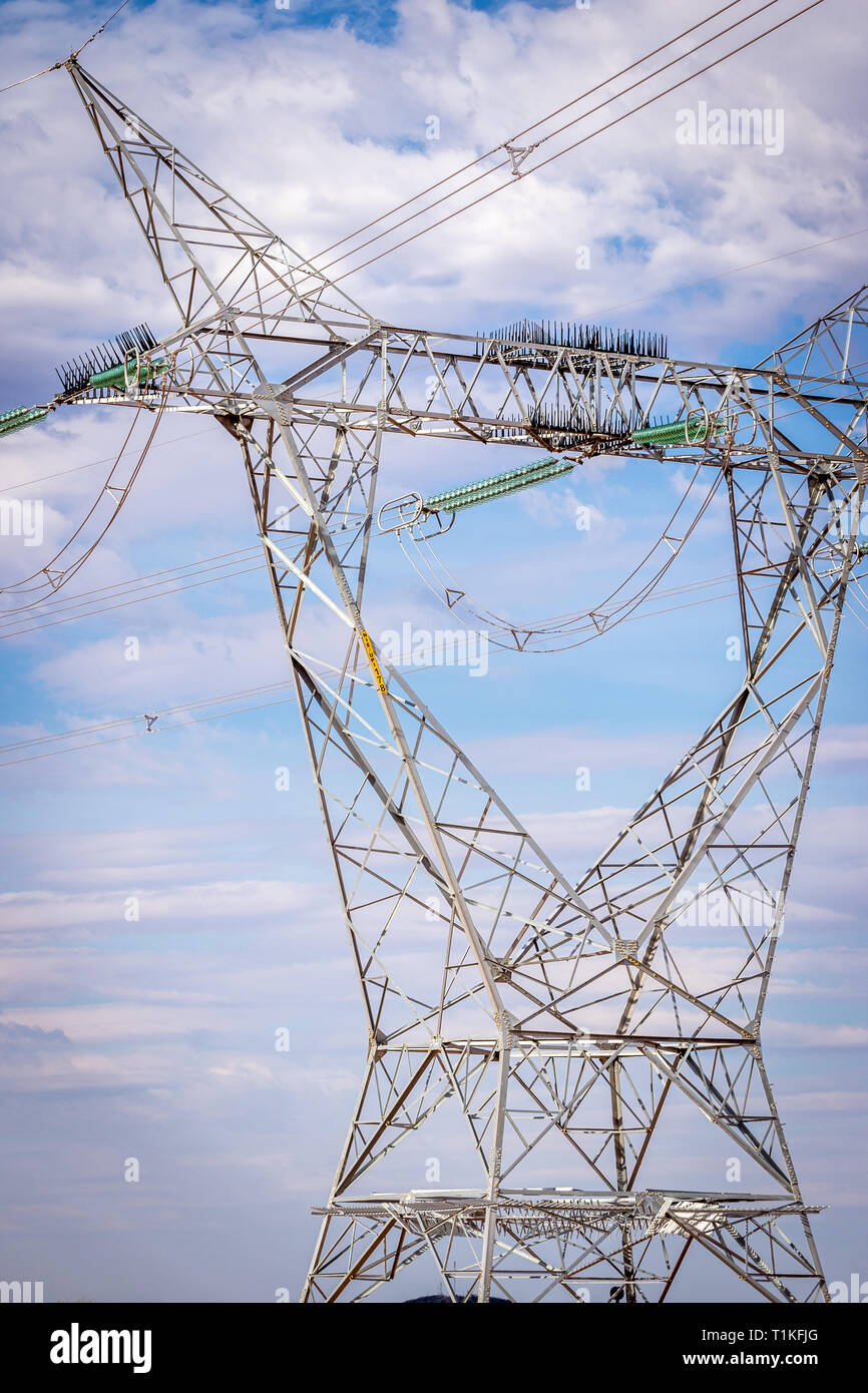 Overhead high voltage power lines Stock Photo