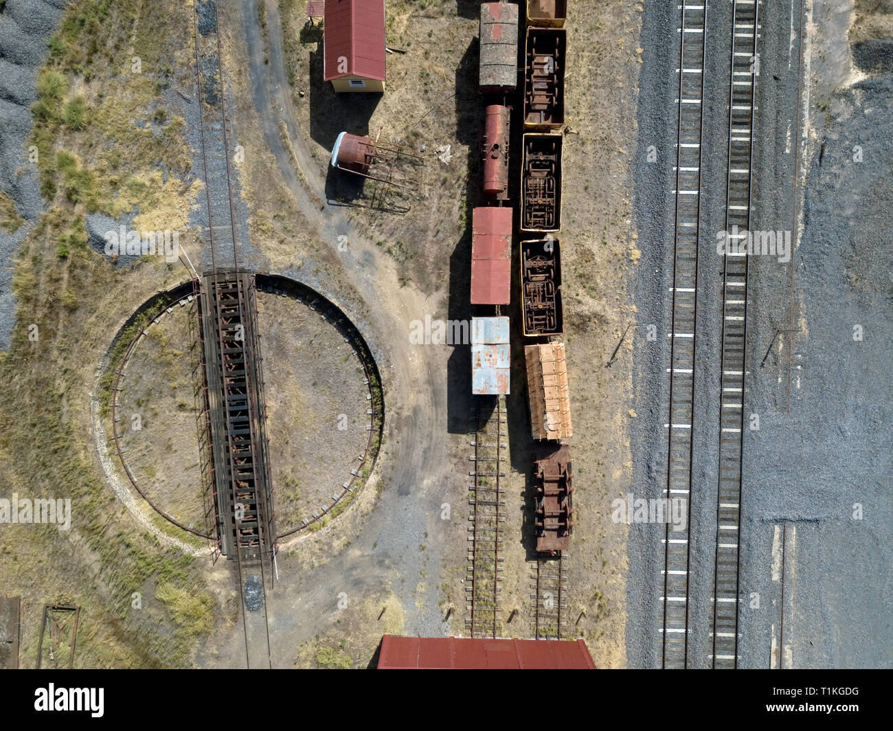 Old train tracks, train turntable, train yard cars and train yard above