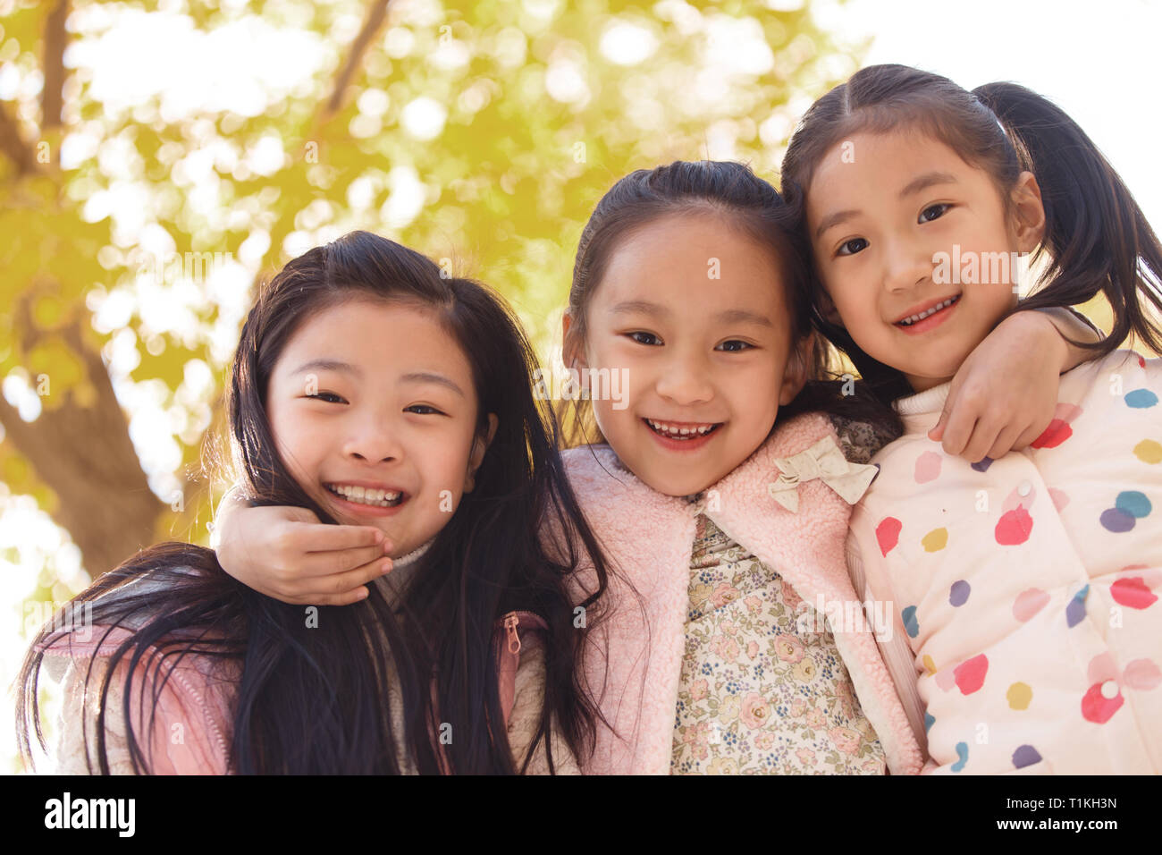 Happy little girl playing outside Stock Photo - Alamy