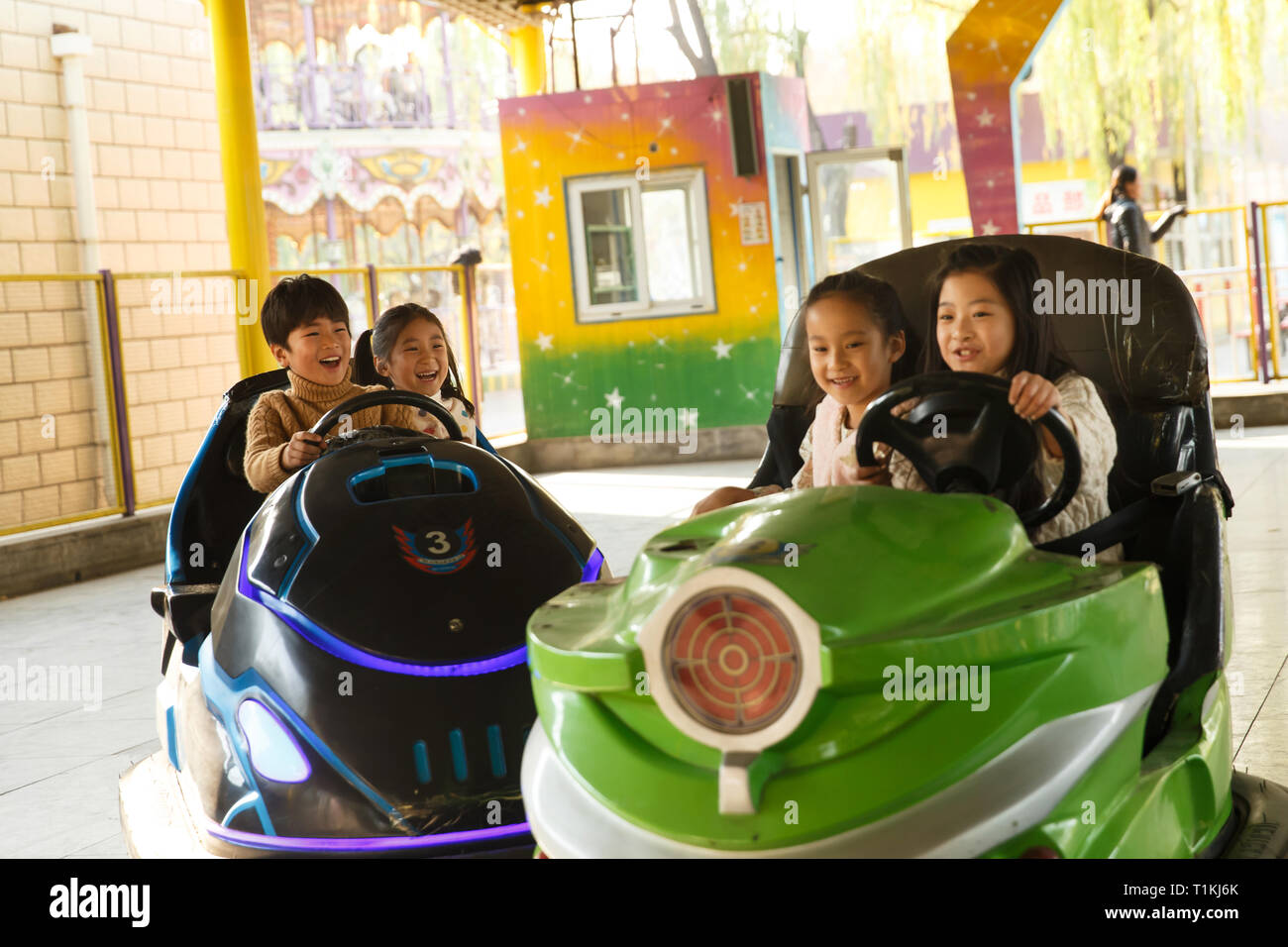 Elementary school students play in the playground Stock Photo