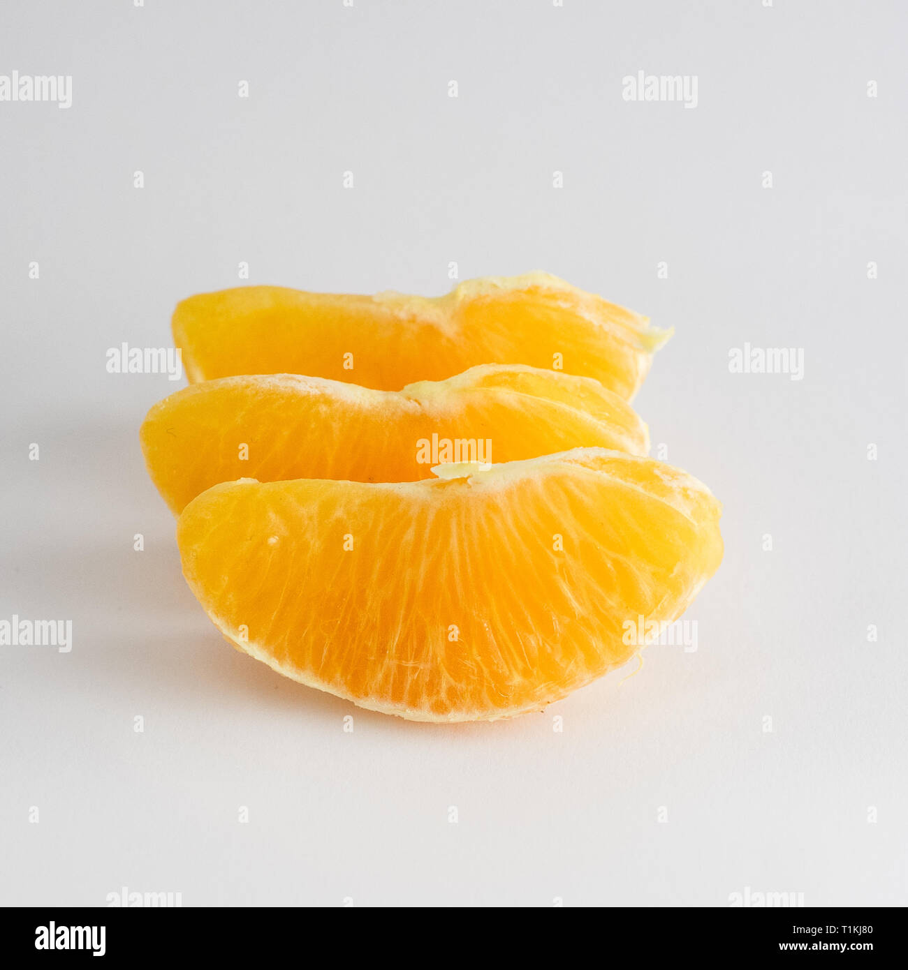 Orange slice on white background Stock Photo