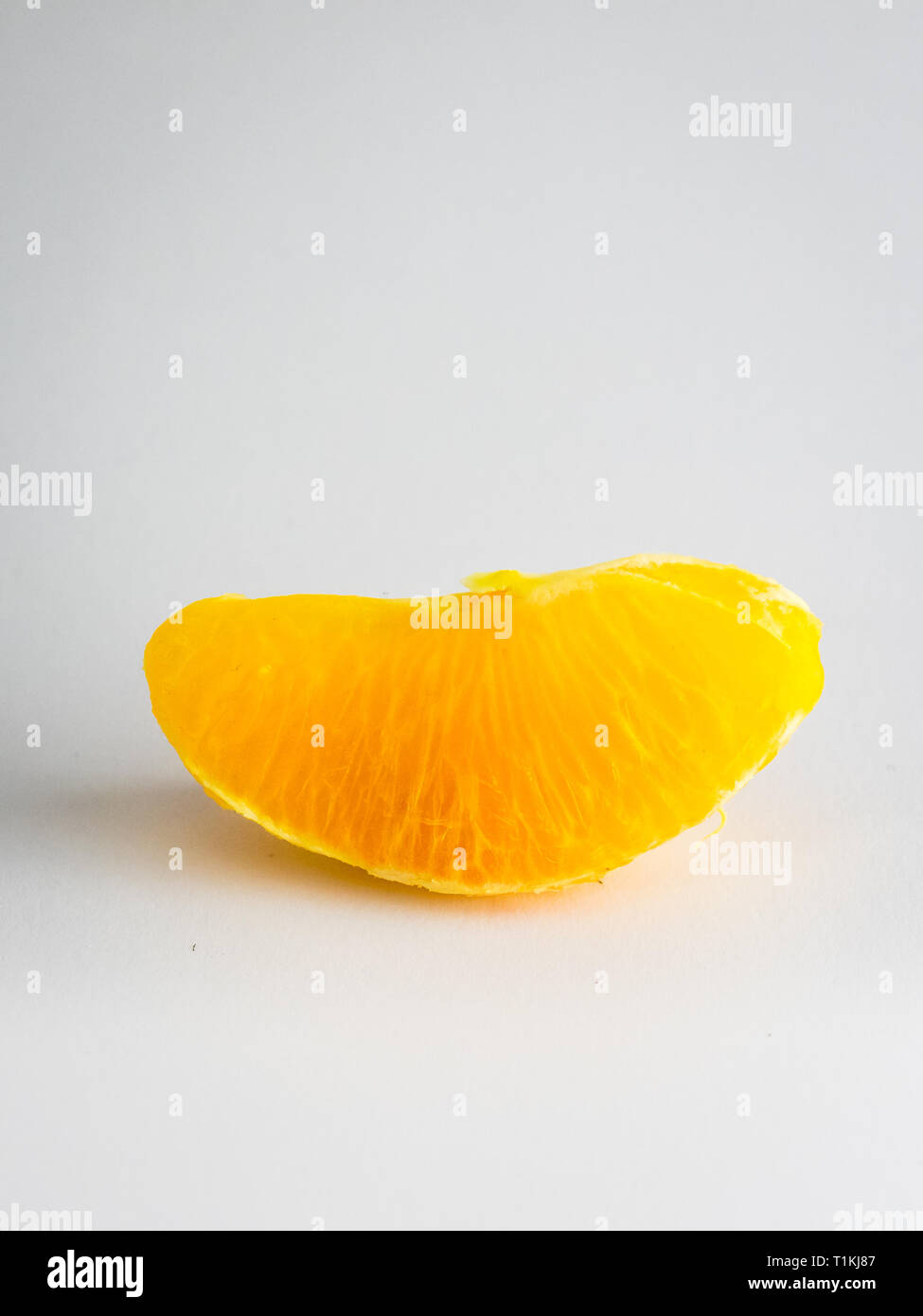 Orange slice on white background Stock Photo