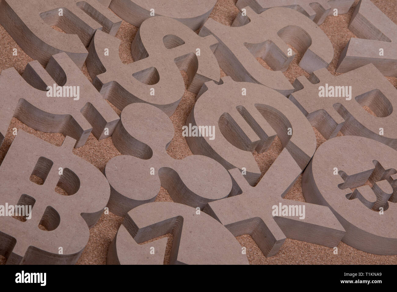 Various Wooden Sings or Symbols of World Currencies in Group Picture with Diffused Light Stock Photo