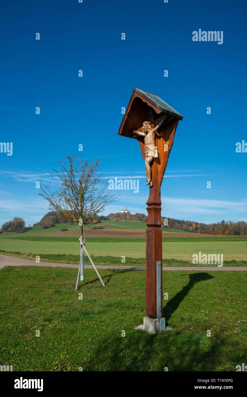 GERMANY, BADEN-WUERTTEMBERG, a wooden crucifix marks an intersection in the fields below castle Baldern Stock Photo