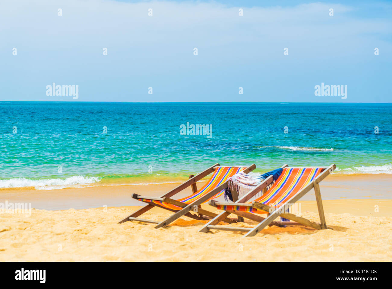 Two Deck chairs at the beach Stock Photo - Alamy