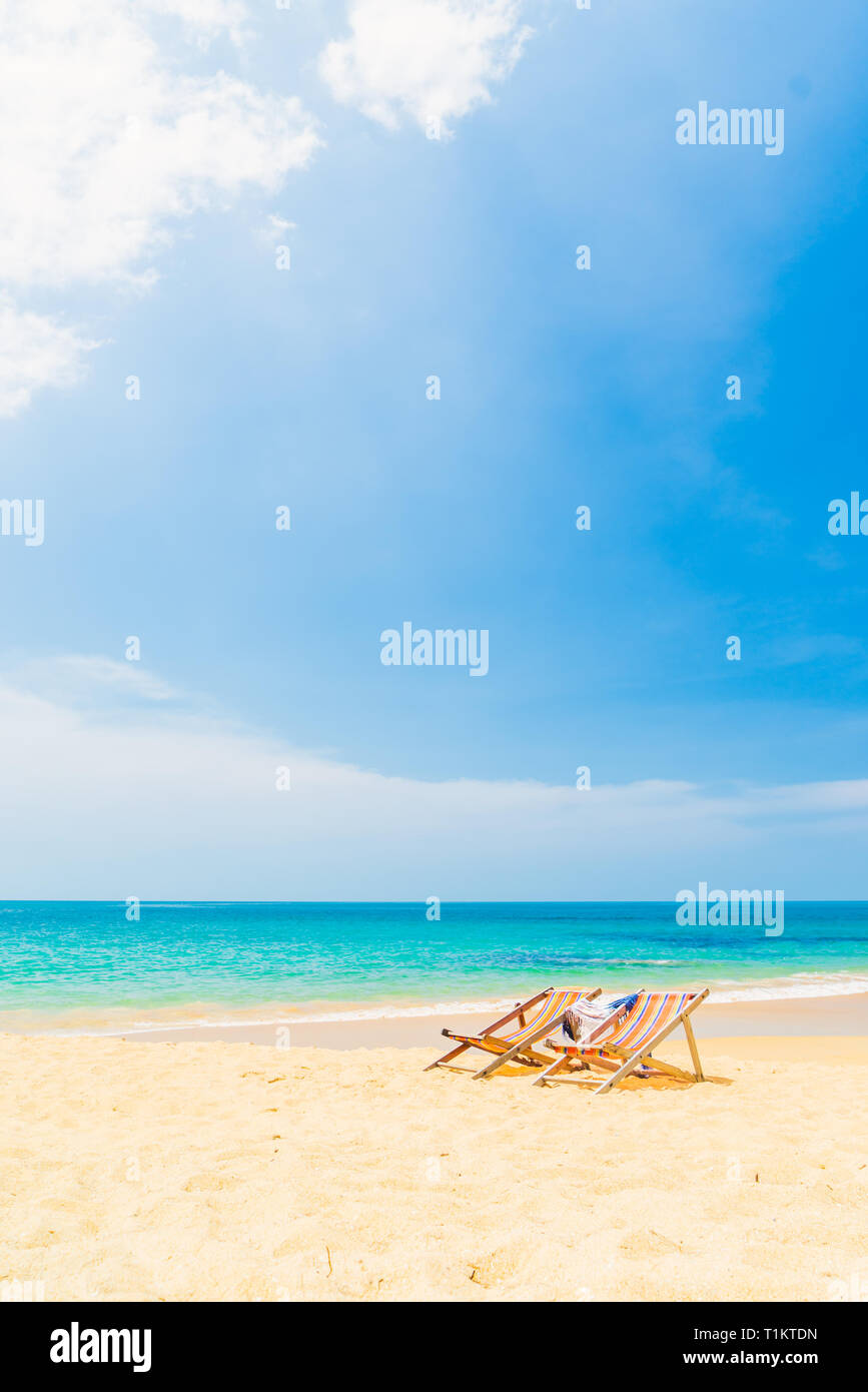 Palm tree two deck chairs hi-res stock photography and images - Alamy