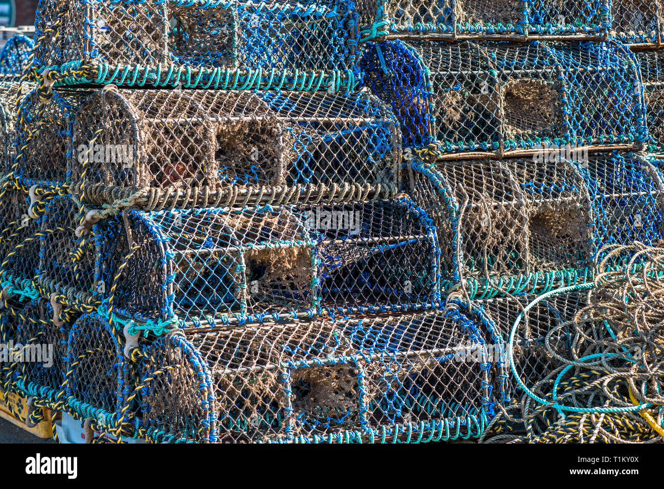 Crab and lobster pots or creels stacked on Wells-next-the-sea seafront. North Norfolk coast, East Anglia, England, UK. Stock Photo