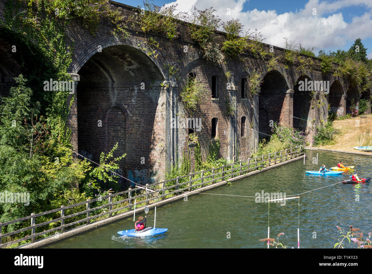 People canoeing in Stroudwater Navigation canal, Gloucestershire, UK Stock Photo