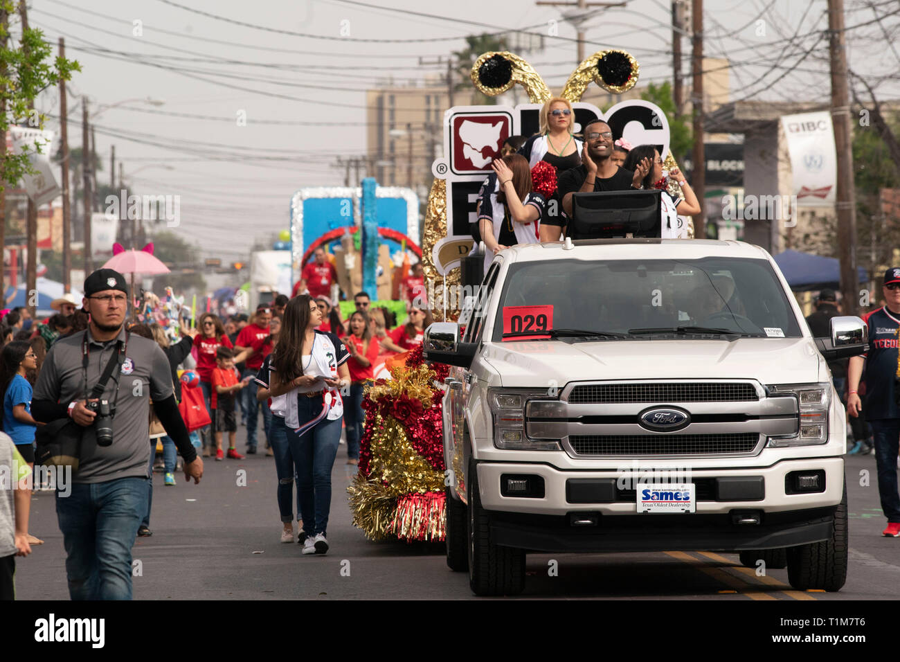 Pickup truck pulls float through streets of Laredo, Texas, during annual Washington's Birthday Celebration parade. Stock Photo