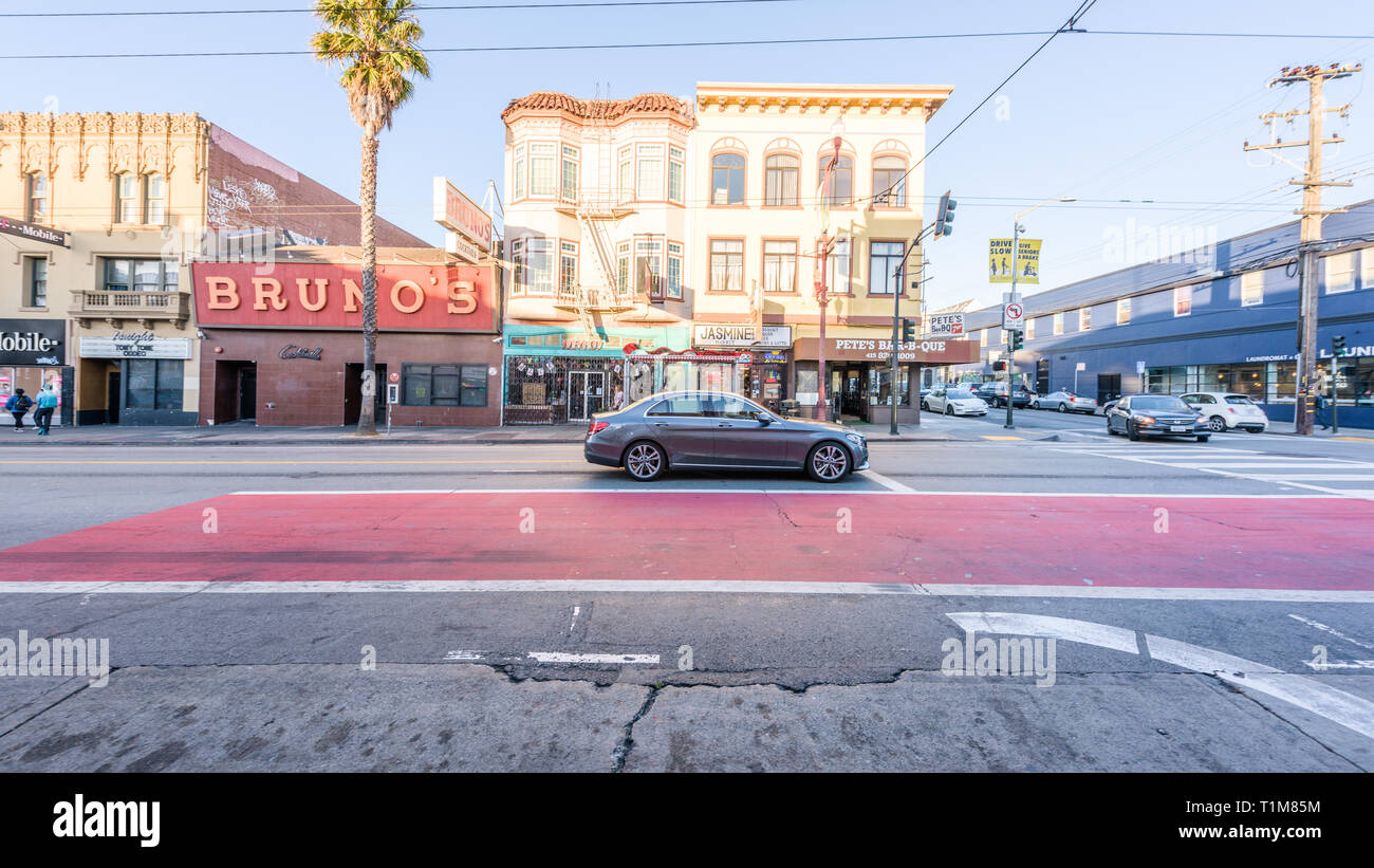 SAN FRANCISCO, USA - 10 Jul 2018: A heritage old cottage dominates a crossroads in Mission Street, in Liberty Street Historic District, a heritage nei Stock Photo