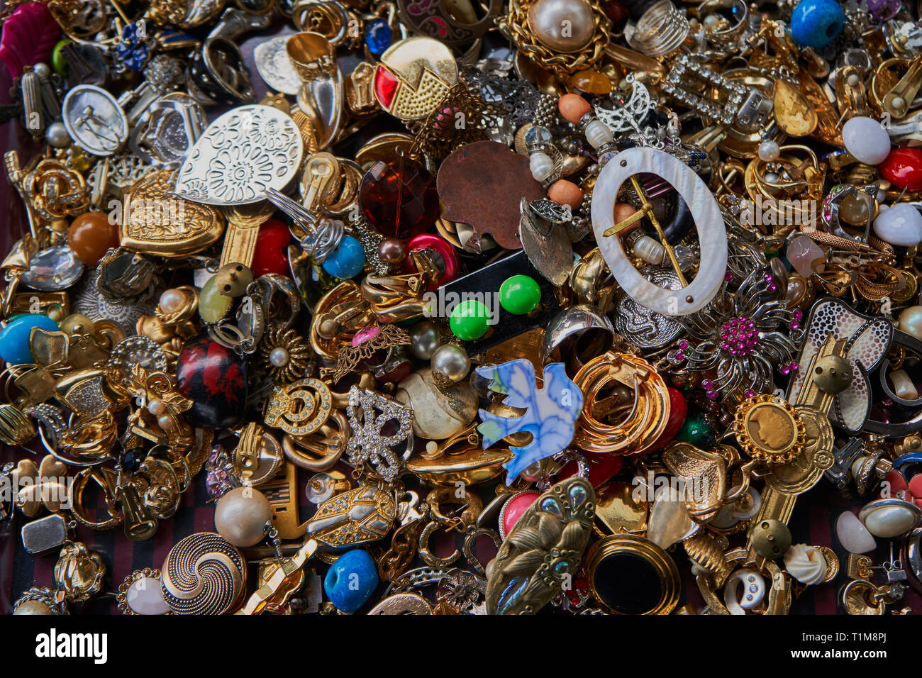 Collection of fashion jewelry with different shapes, colors and materials. Found on a flea market. Stock Photo