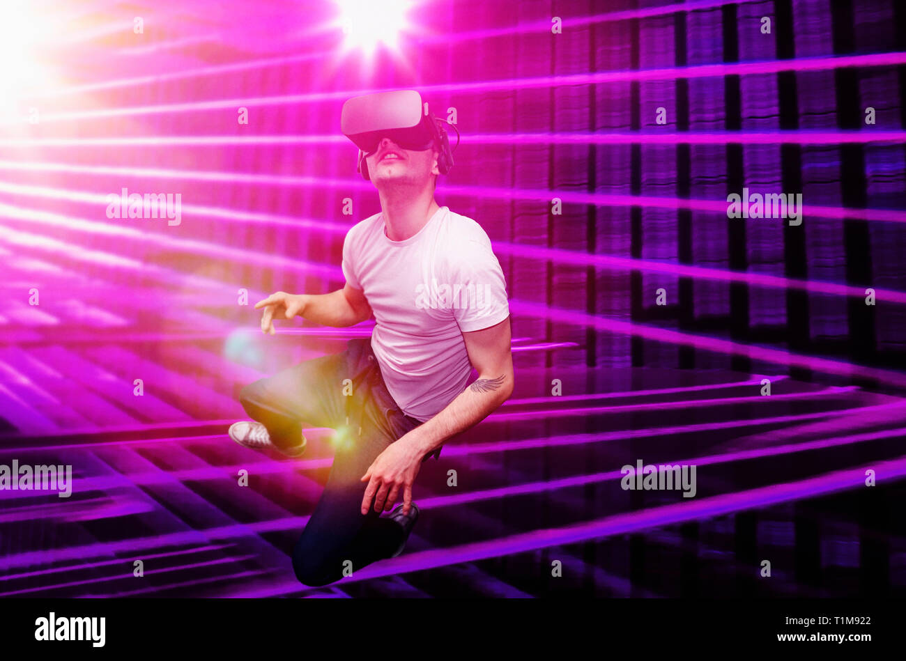 Young man using virtual reality simulator glasses Stock Photo