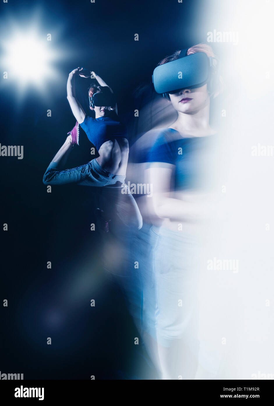 Multiple exposure female modern dancer wearing virtual reality simulator glasses Stock Photo