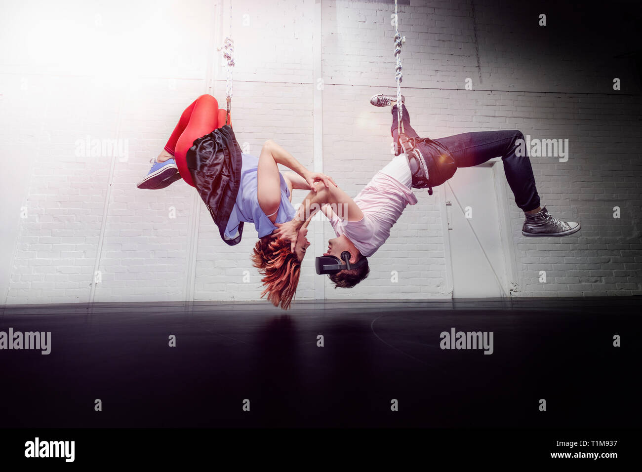 Modern aerialist dancers hanging Stock Photo