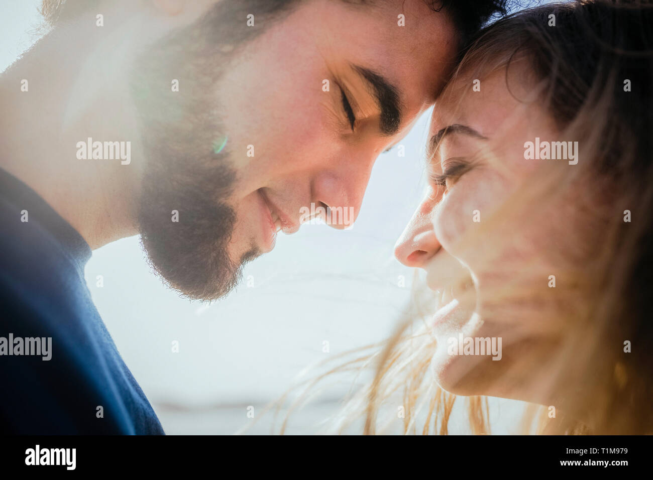 Affectionate young couple close hi-res stock photography and images - Alamy