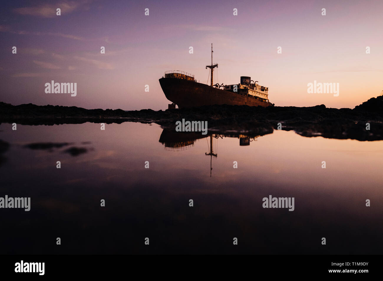 Stranded boat, Costa Teguise, Canary Islands, Spain Stock Photo