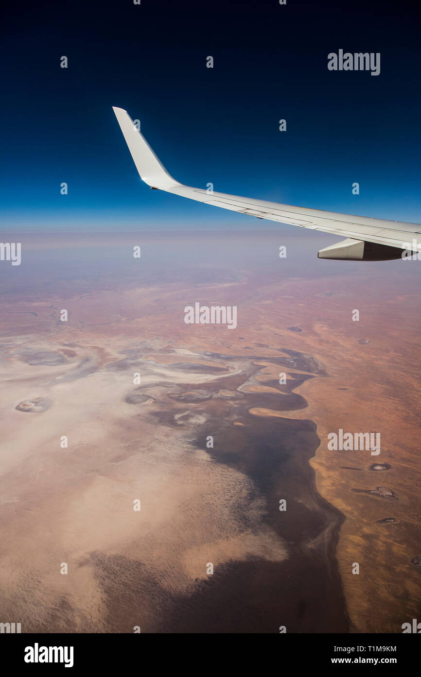 Aerial view airplane wing over landscape Stock Photo