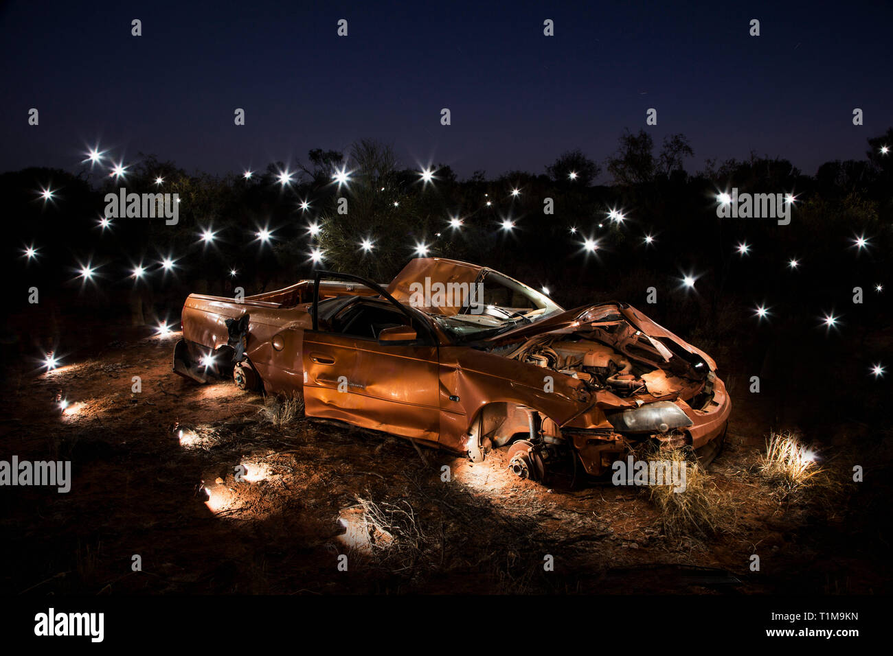 Lights illuminating art installation of crushed car Stock Photo Alamy