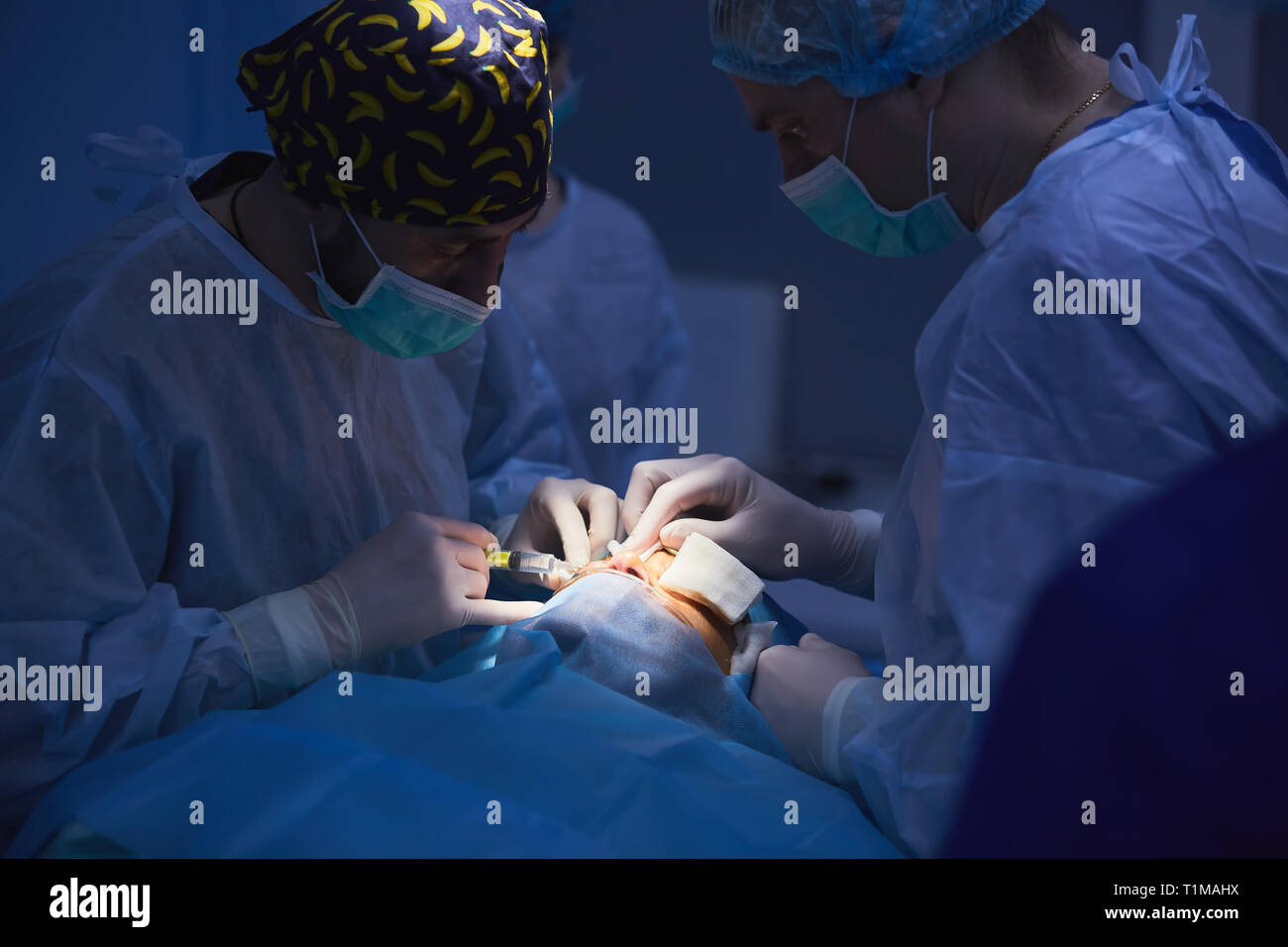 Medical Team Performing Surgical Operation in Modern Operating Room ...