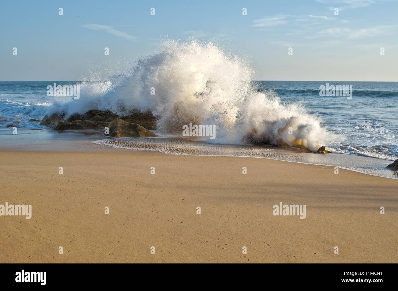 Waves and sunset in Salgados beach. Albufeira, Portugal Stock Photo