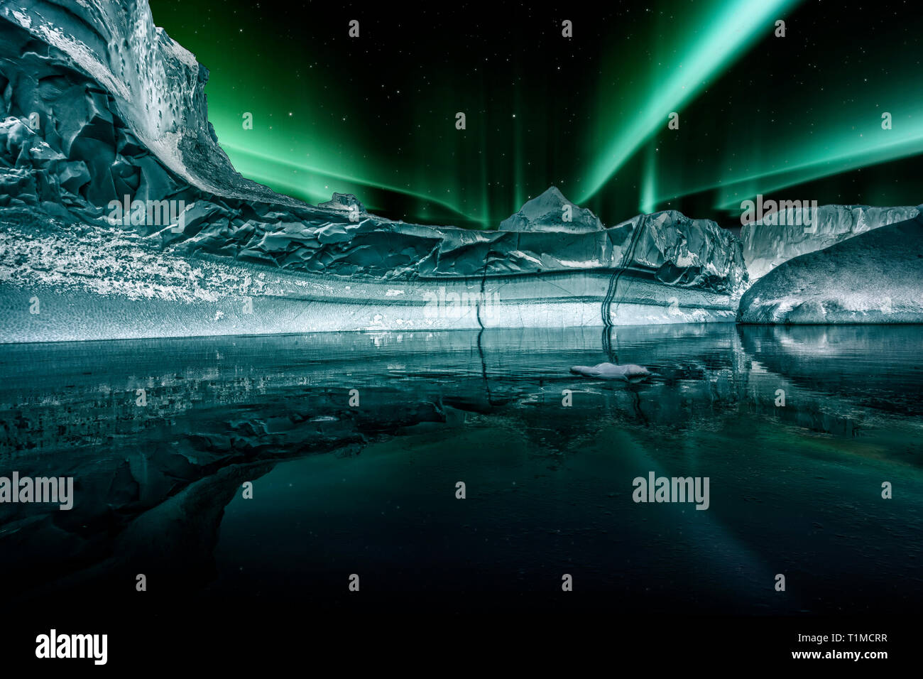 iceberg floating in greenland fjord at night with green northern lights  Stock Photo - Alamy