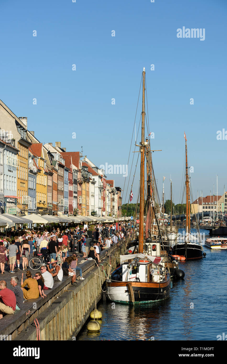 Copenhagen. Denmark. Tourist crowds on Nyhavn waterfront. Stock Photo