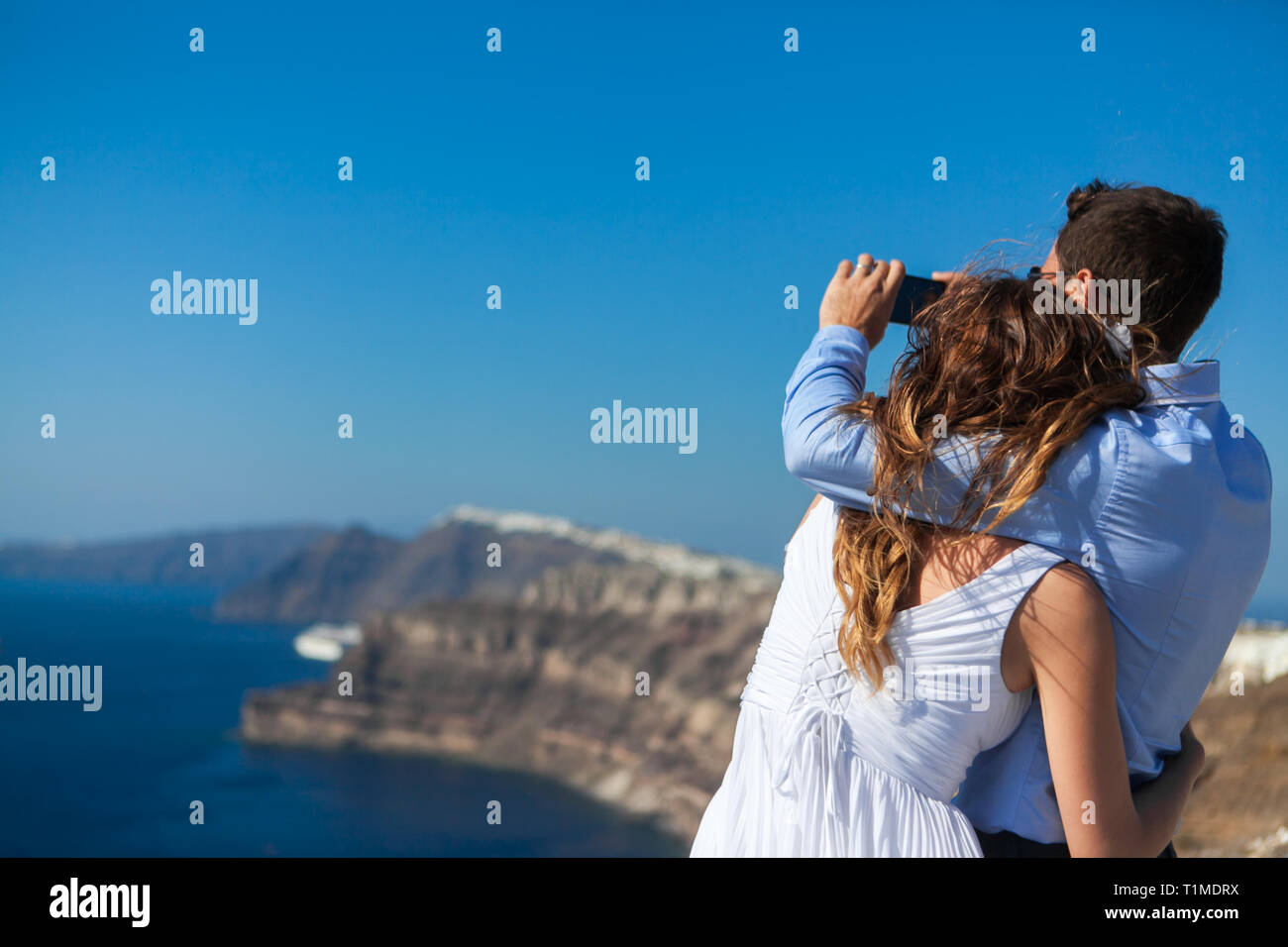 Young Couple Honeymoon On The Most Romantic Island Santorini Young Couple Honeymoon On The Most Romantic Island Santorini