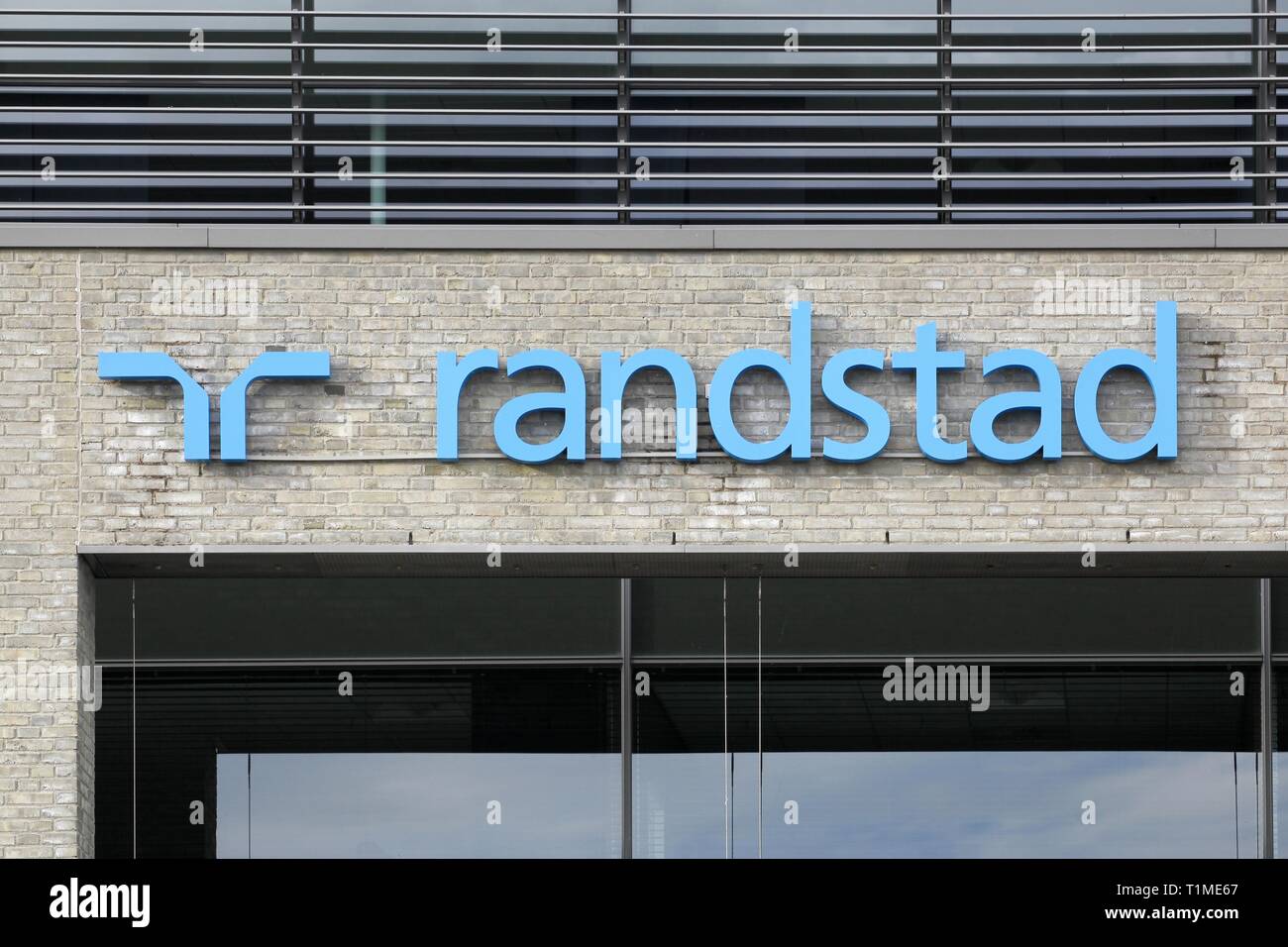 Tilst, Denmark - October 7, 2018: Randstad logo on a wall. Randstad is a Dutch multinational human resource consulting firm headquartered in Diemen Stock Photo