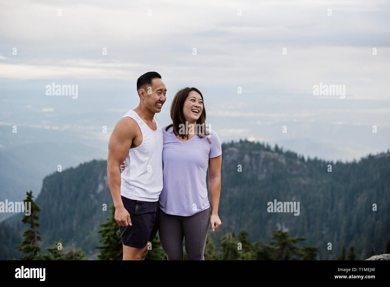 Happy asian couple standing hi-res stock photography and images - Alamy