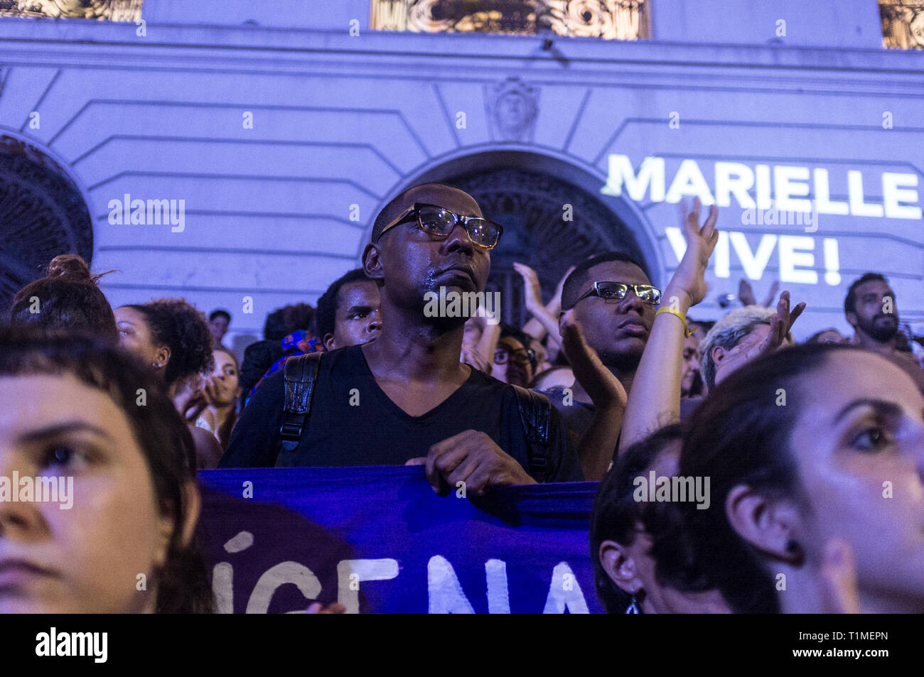 Demonstration for Marielle Franco, Brazilian feminist, politician and human rights activist, murdered on 14 March 2018 in Rio de Janeiro -  she had been an outspoken critic of police brutality and extrajudicial killings. Protestors get emotional, 'Marielle vive' means Marielle is alive, downtown Rio de Janeiro, Brazil. Stock Photo