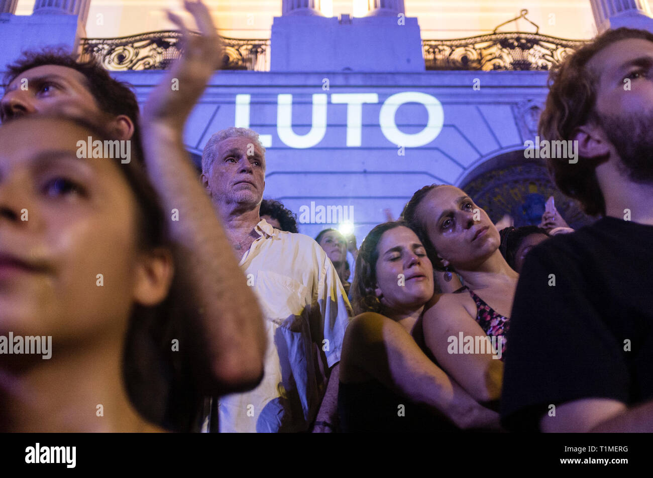 Demonstration for Marielle Franco, Brazilian feminist, politician and human rights activist, murdered on 14 March 2018 in Rio de Janeiro -  she had been an outspoken critic of police brutality and extrajudicial killings. Protestors get emotional, 'luto' means mourning, downtown Rio de Janeiro, Brazil. Stock Photo