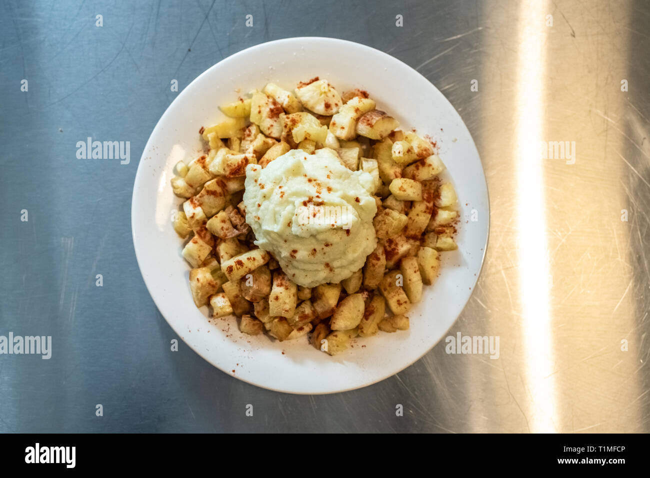 Yuca fried with hummus sauce. Stock Photo