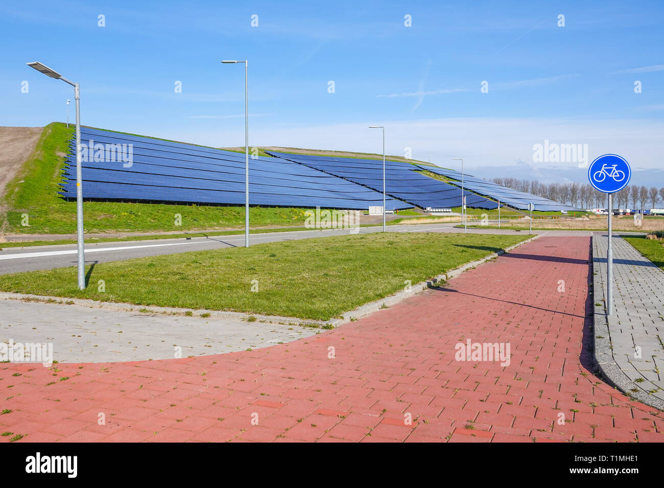 A hilside ful of solar panels providing clean electric power Stock Photo