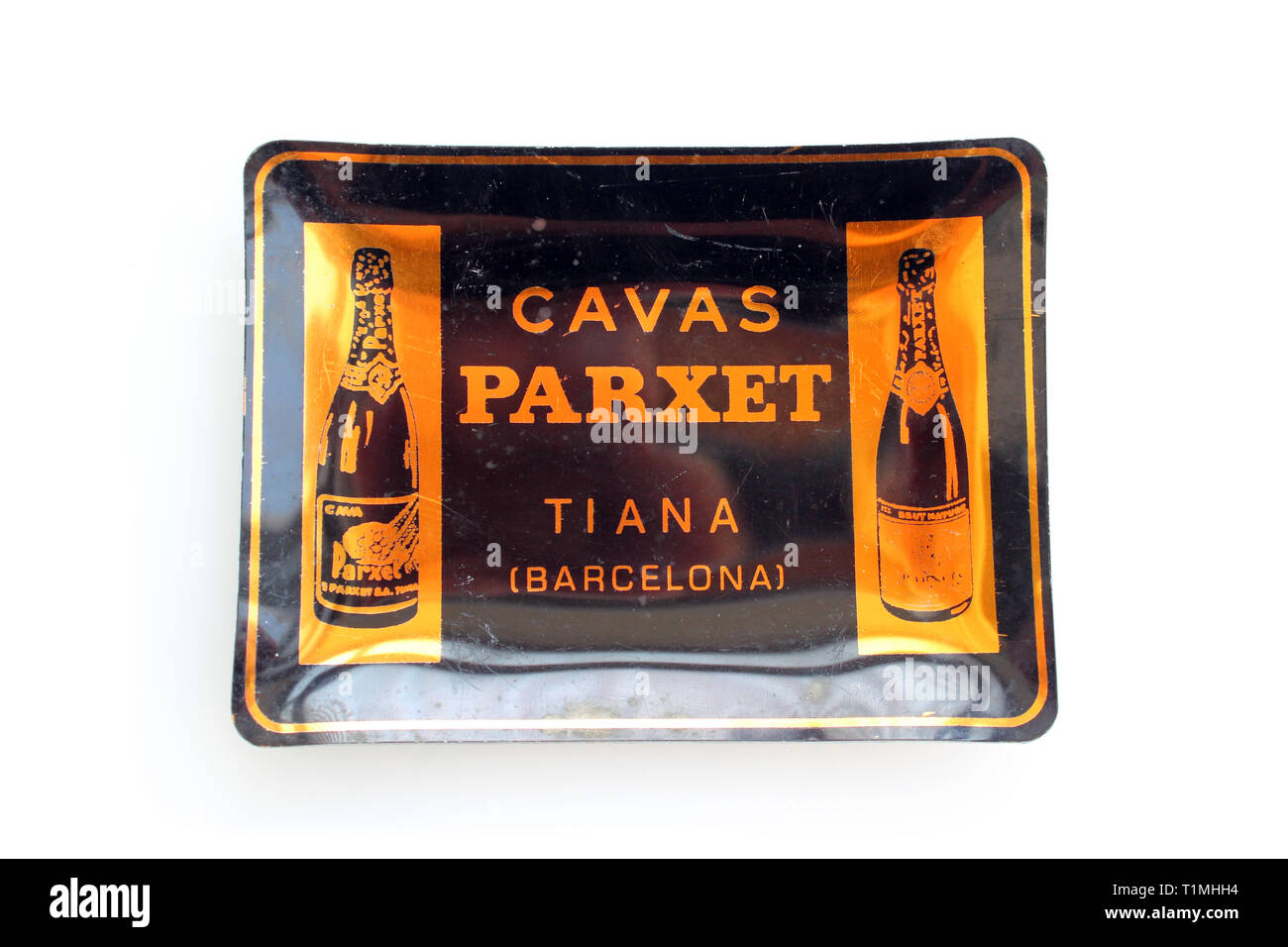 Vintage black and golden promotional souvenir ashtray Barcelona cava brand, isolated on a white background, close up Stock Photo
