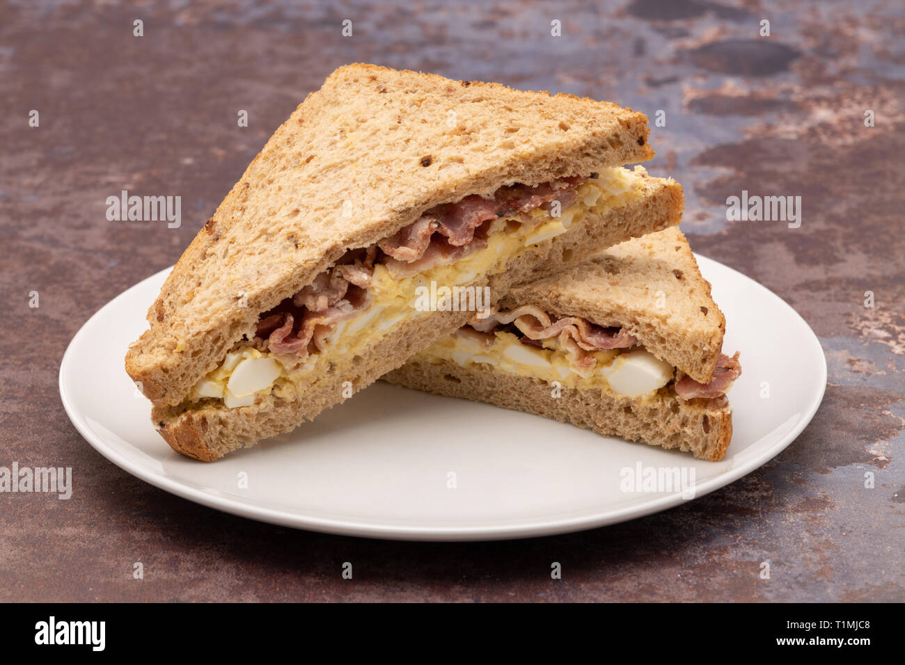 Egg and bacon sandwich with brown wholemeal bread Stock Photo Alamy
