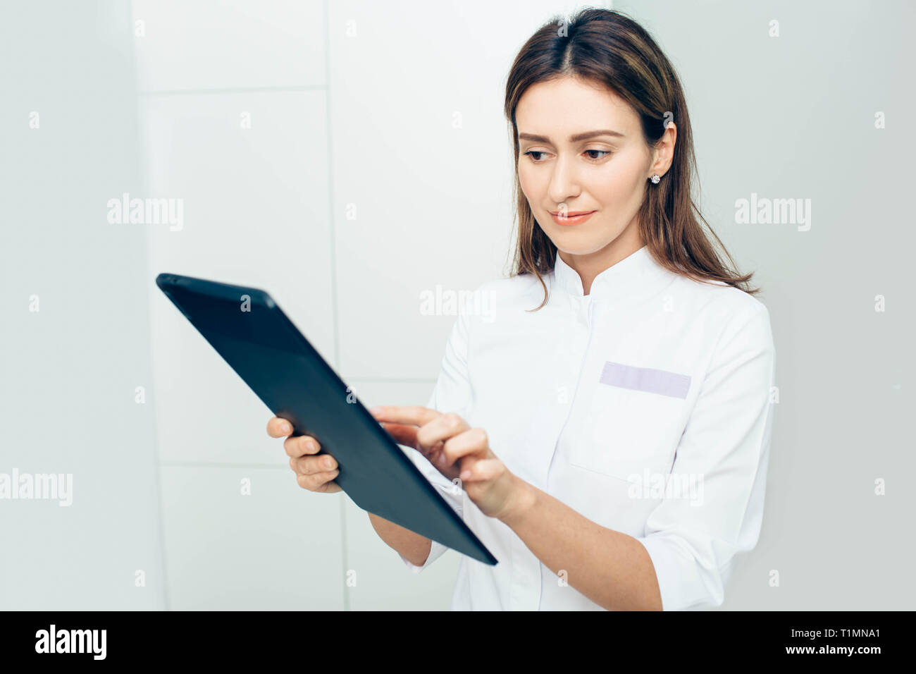 Shot of a female doctor using a digital tablet in in clinic Stock Photo