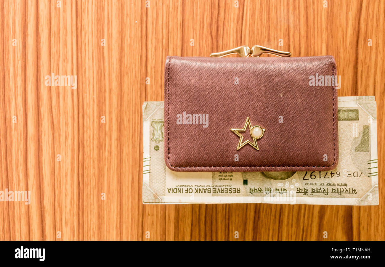 Indian Five Hundred 500 Rupee Cash Note in Brown Color Wallet Leather Purse  on a Wooden Table. Business Finance Economy Concept Stock Photo - Image of  expense, extreme: 143041162