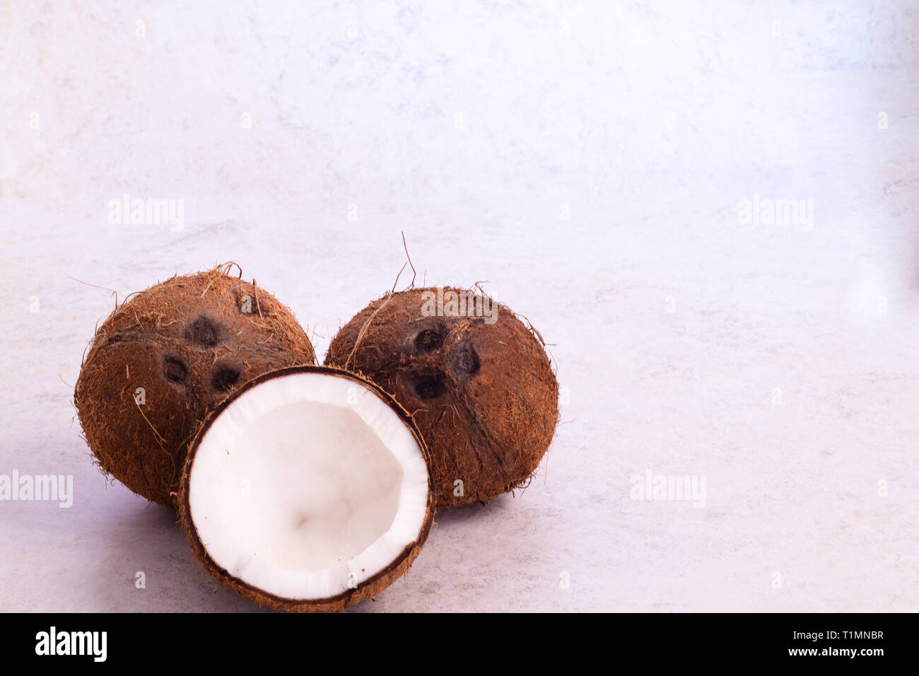 Coconuts with textured background Stock Photo - Alamy
