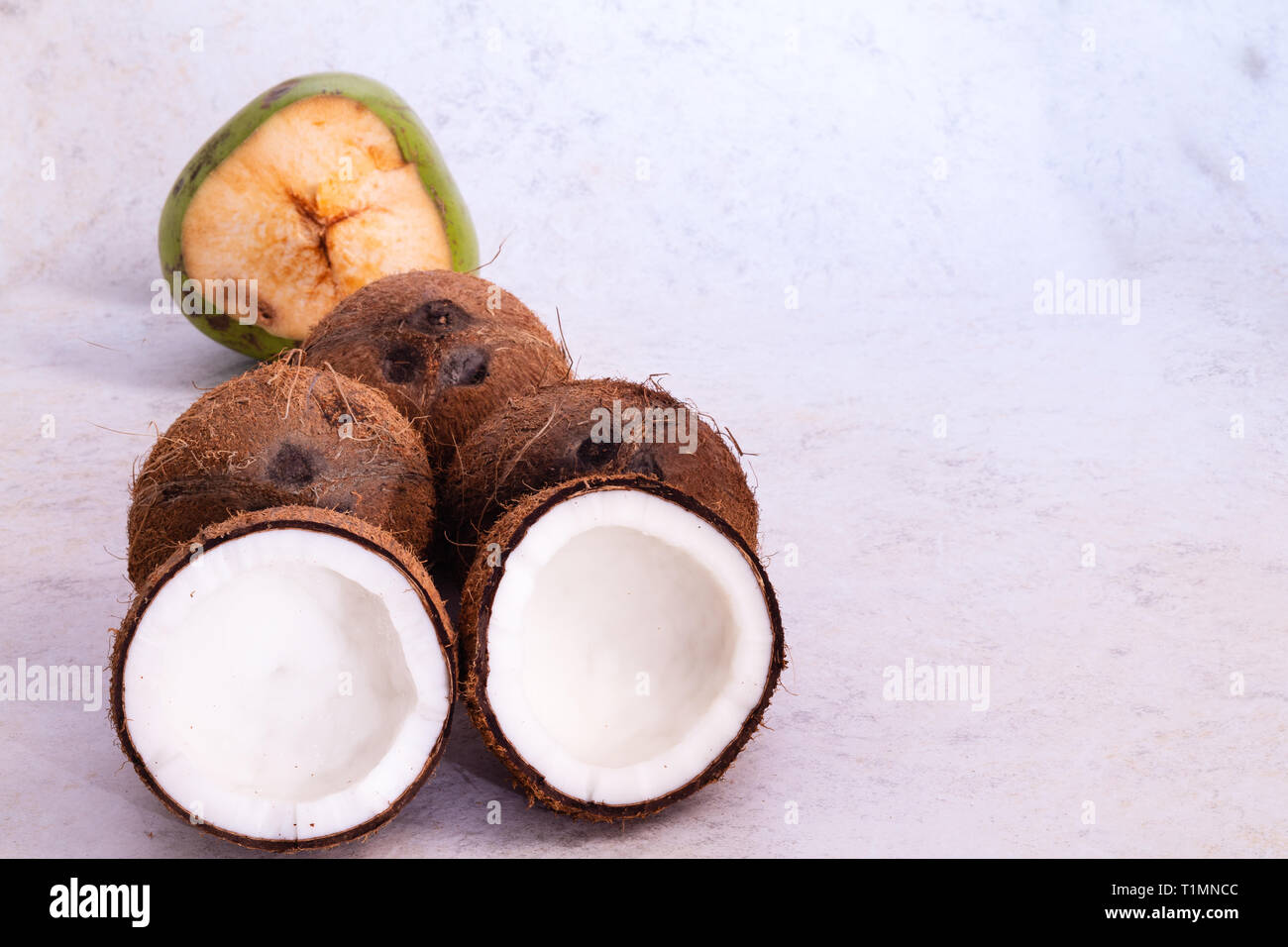 Coconuts with textured background Stock Photo - Alamy