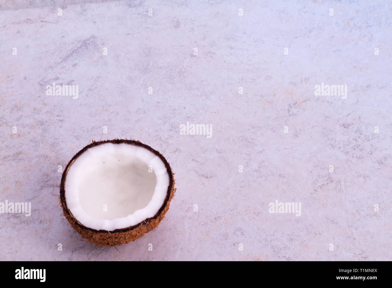 Coconuts with textured background Stock Photo - Alamy