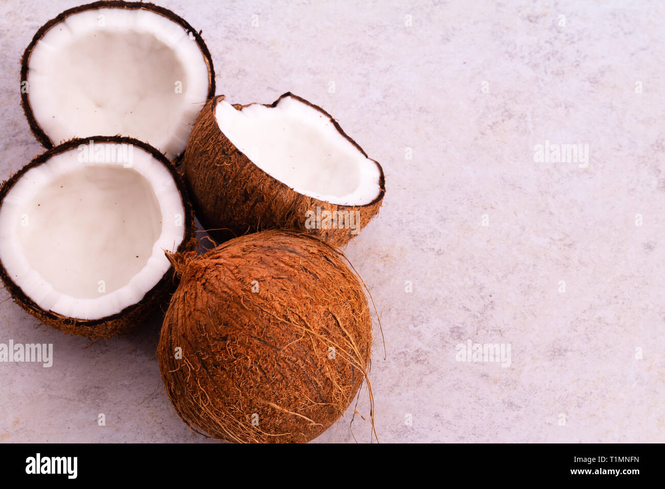 Coconuts with textured background Stock Photo - Alamy
