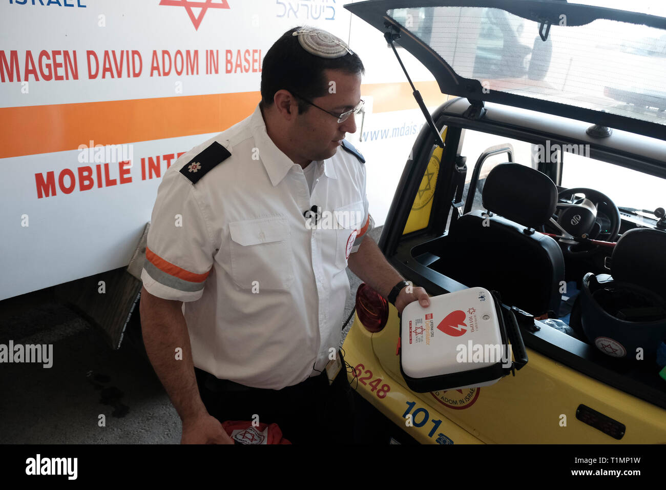 Manager of department of 'Magen David Adom' Israel's national emergency medical service holds a portable defibrillation device for treatment of life-threatening cardiac dysrhythmias. Stock Photo