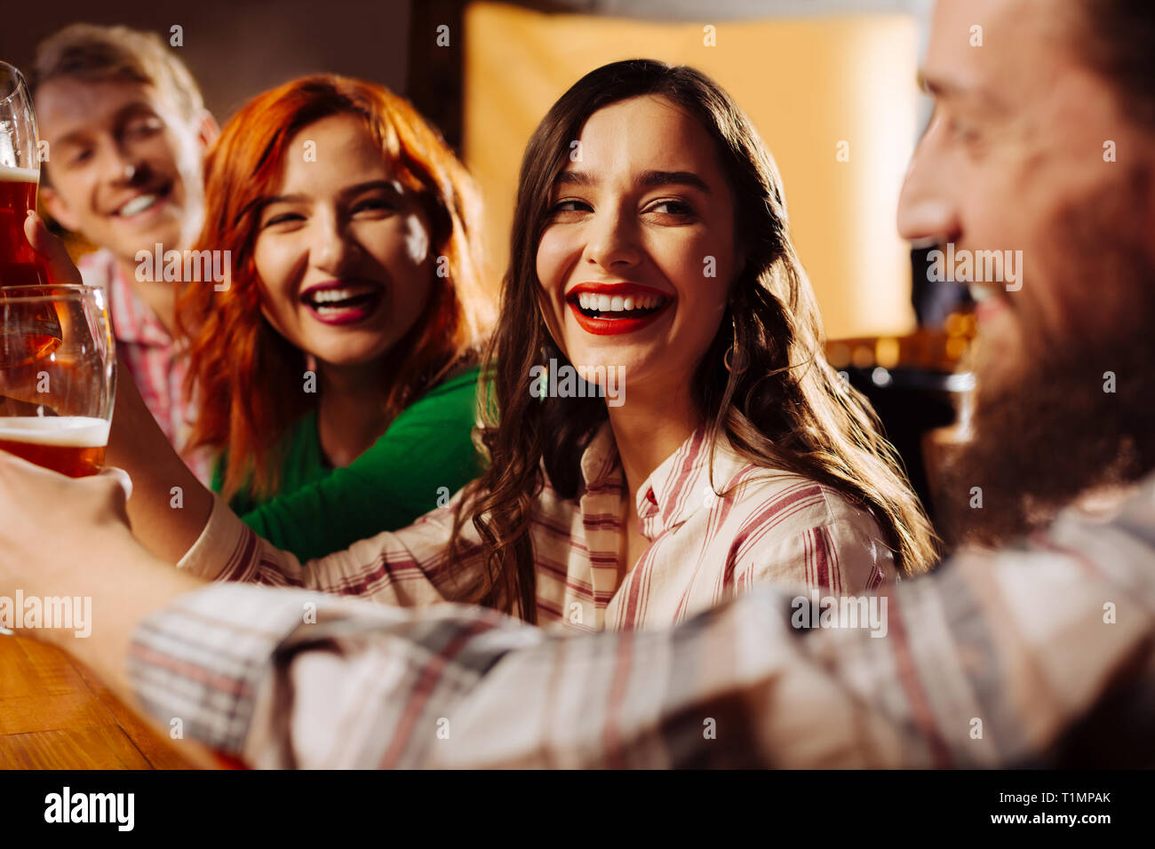 Women spending night with their boyfriends in the bar Stock Photo