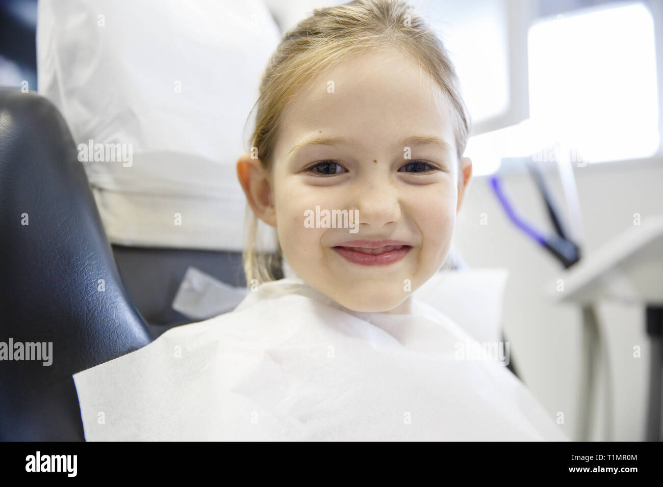 Smiling little girl in the dental office. Prevention, pediatric dental