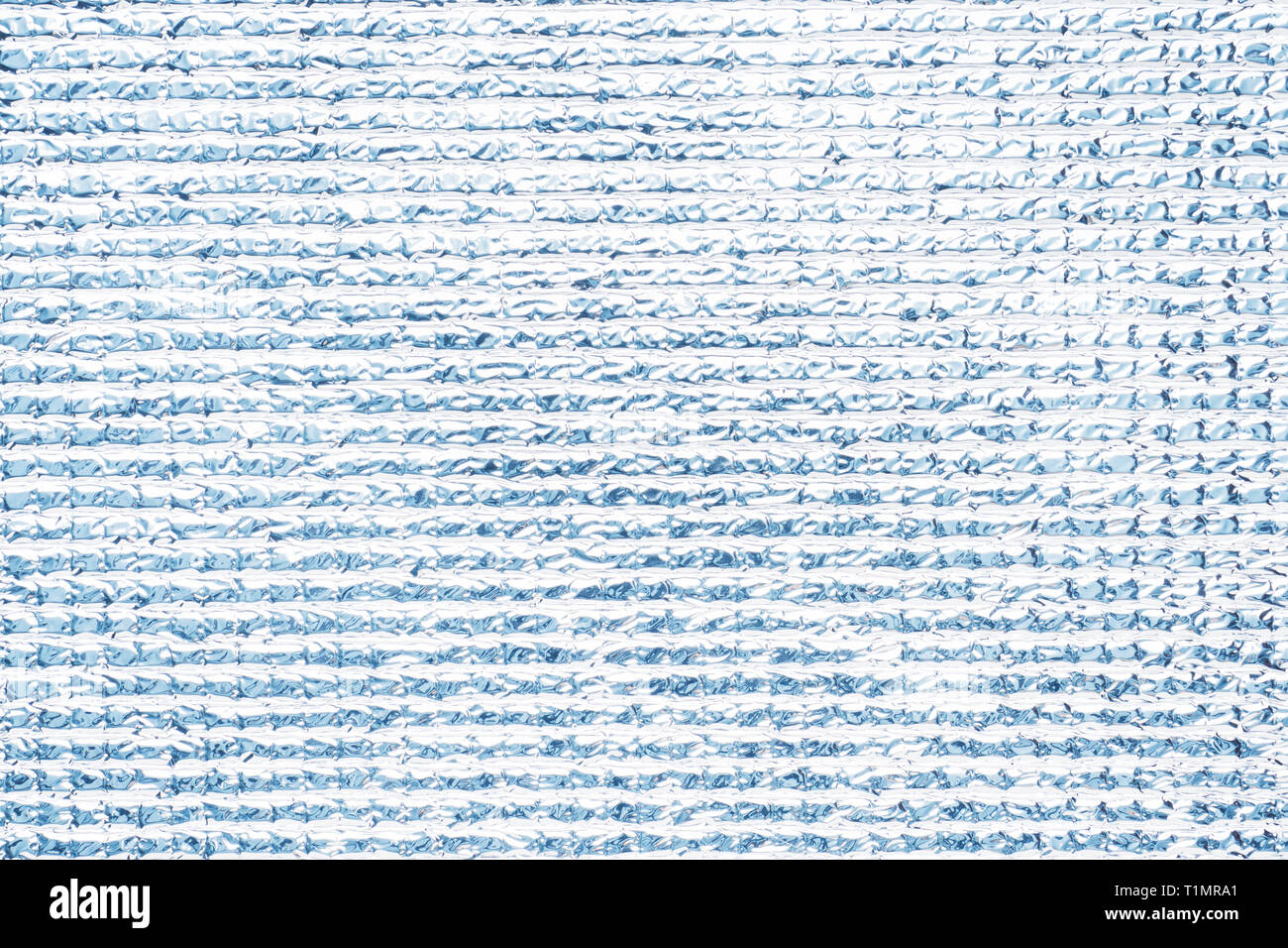 Silvery polyethylene texture Grey shiny background. Stock Photo