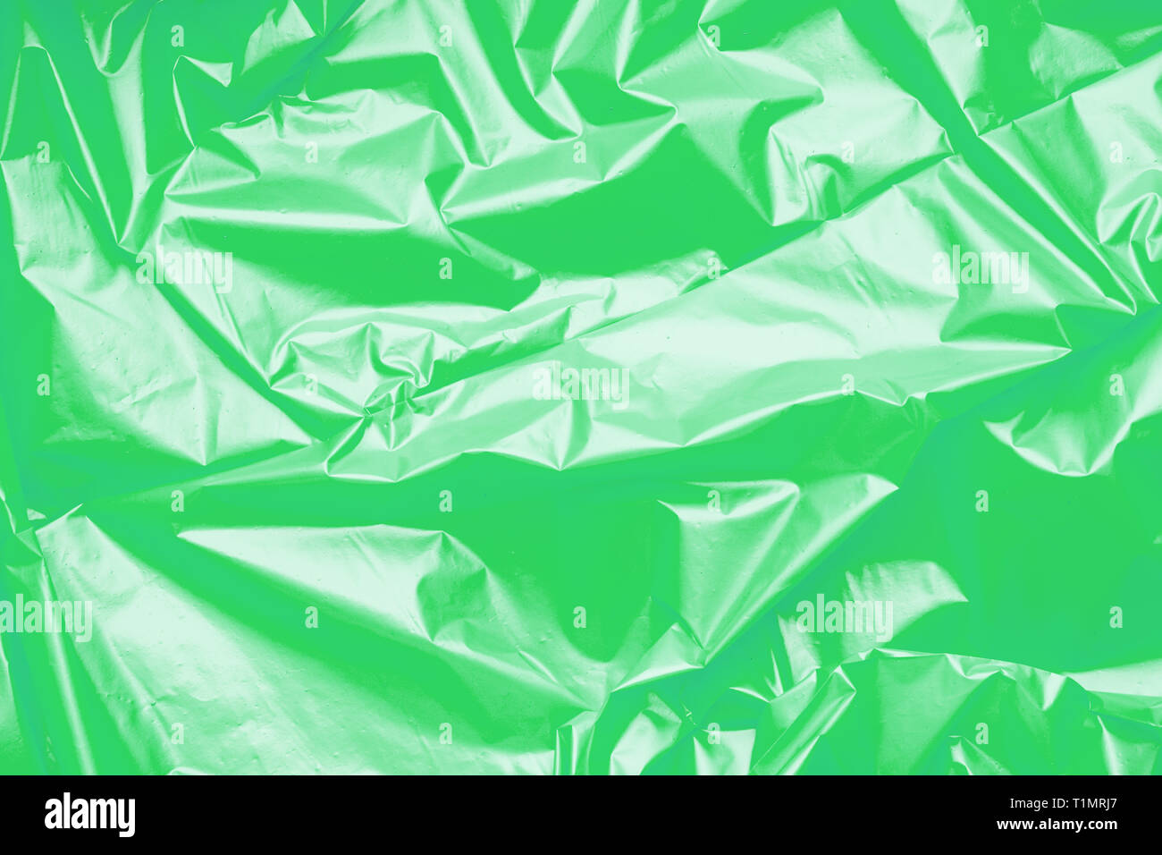 Green polyethylene texture. Background exhaust cellophane package Stock Photo