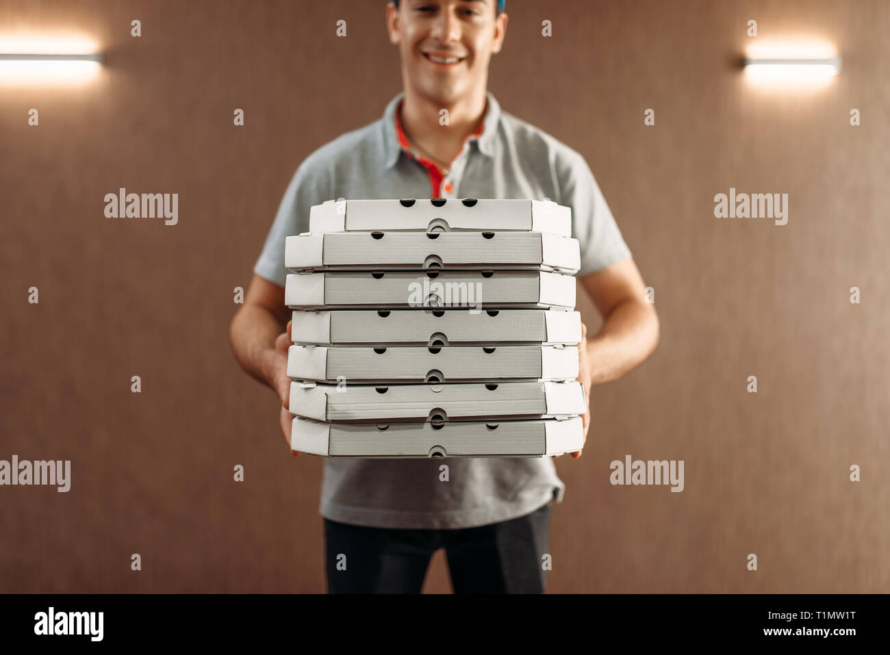 Pizza delivery man hires stock photography and images Alamy