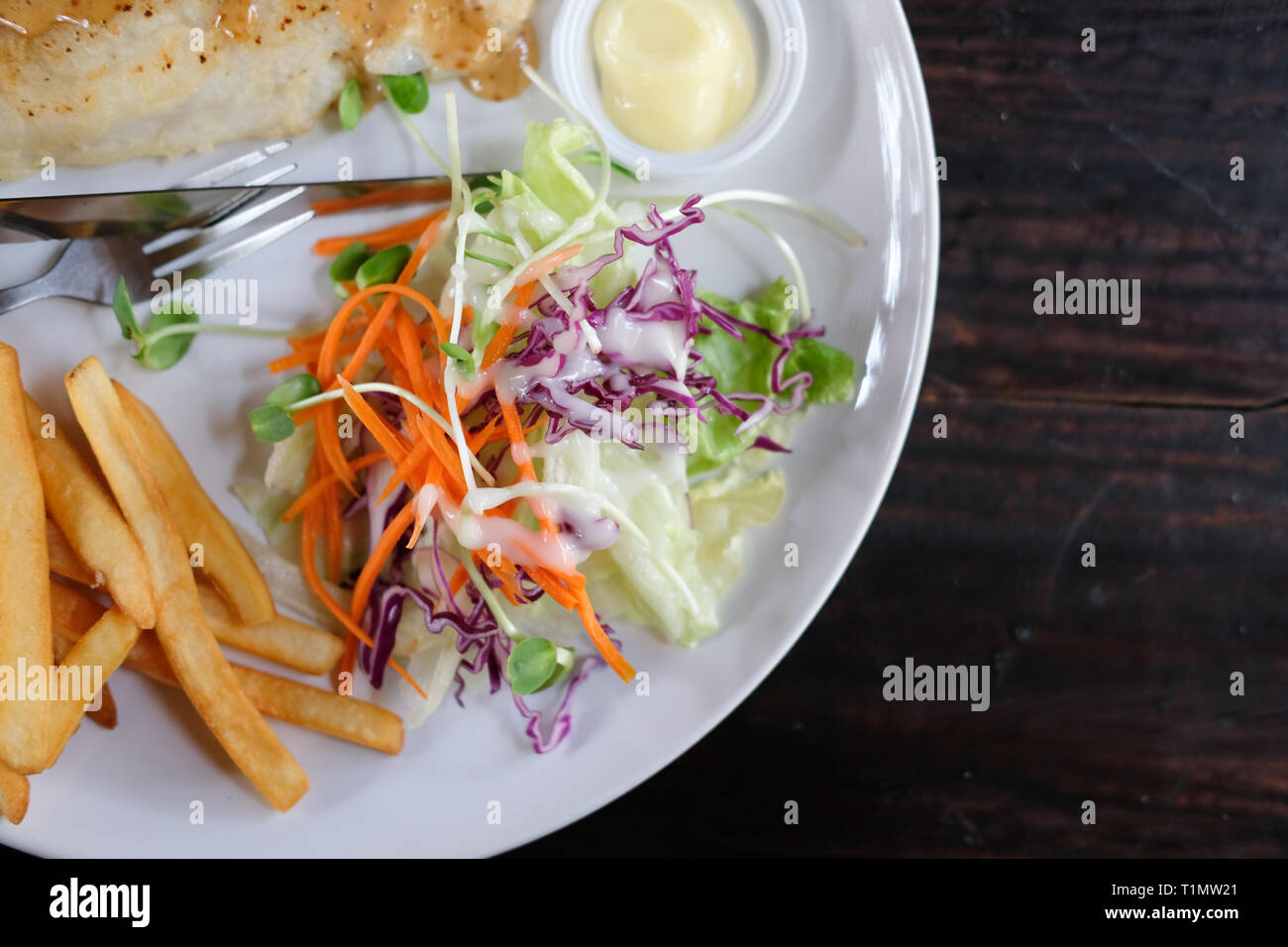 vegetable salad french fries grilled fish mayonnaise Stock Photo Alamy