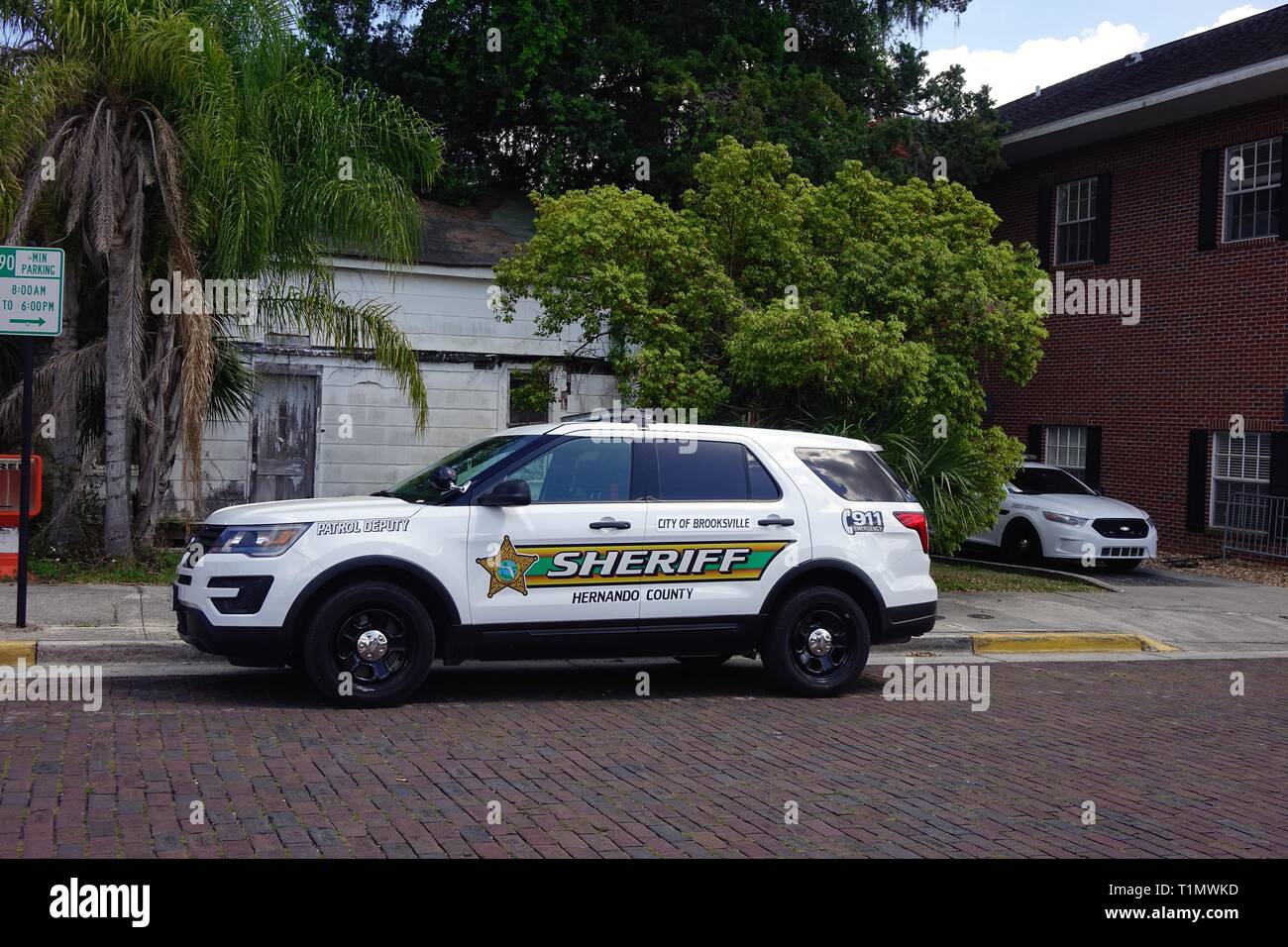Police car parked on a street in downtown Brooksville, Florida Stock